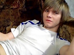 Skinny blond twink Raos takes to the couch and gets his cock out to stroke it eagerly. The green-eyed beauty looks so...