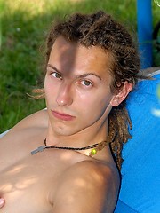 Young rasta boy relaxing in the garden - Gay boys pics at Twinkest.com
