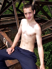 Young guy posing in the industrial decoration - Gay boys pics at Twinkest.com