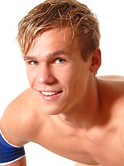 Youn naked kickboxer posing in his sport uniform - Gay boys pics at Twinkest.com