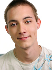 Skinny twink Maxwell strokes his big cock