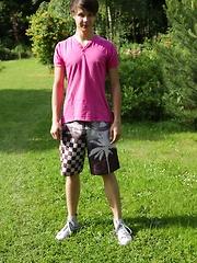 Cute boy Desmond Hall busts a nut in the backyard.